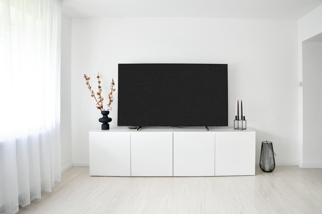 A large black television in a minimal living room, ready for Varesteam4K 4K IPTV